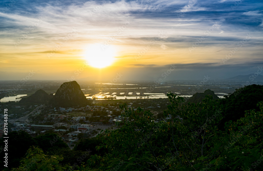 Beautiful sunset in the Marble mountains in Da Nang ,charming view for the city,jungle and sea,travel concept.
