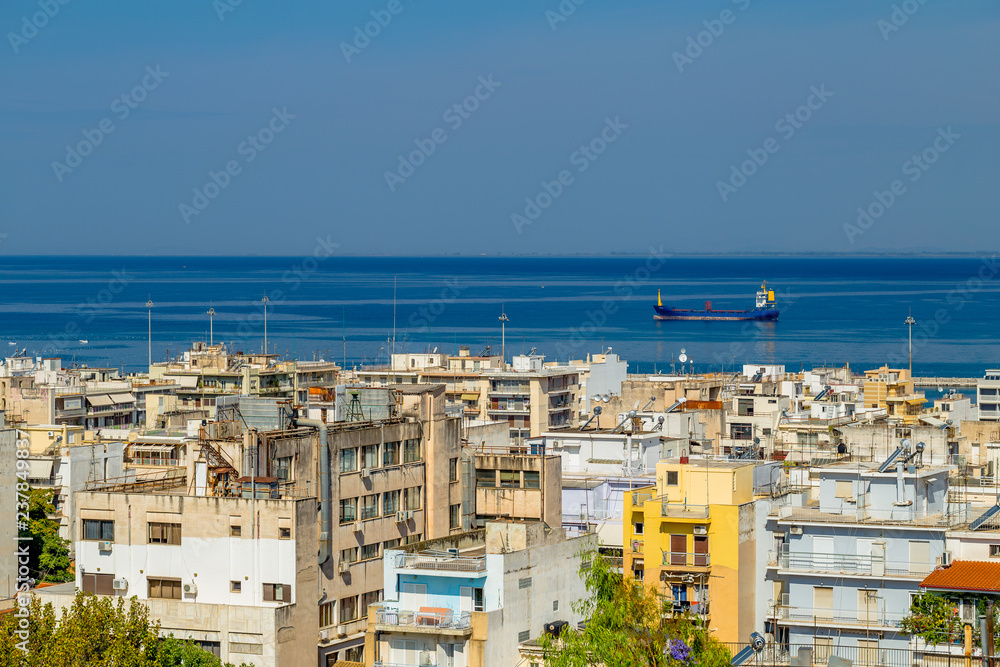 View of the Houses in the Greek Town of Patras and the Sea With the Cargo Ship