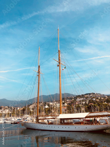 beautiful sail boat with italian flag berthed in Sanremo harbor