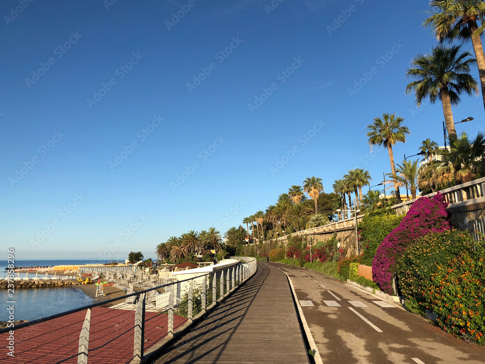 people doing jogging on the bike path in Sanremo seafront