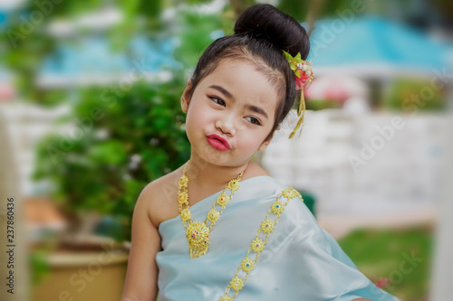 Portrait of a Little girl is Wearing Thai traditional dress.