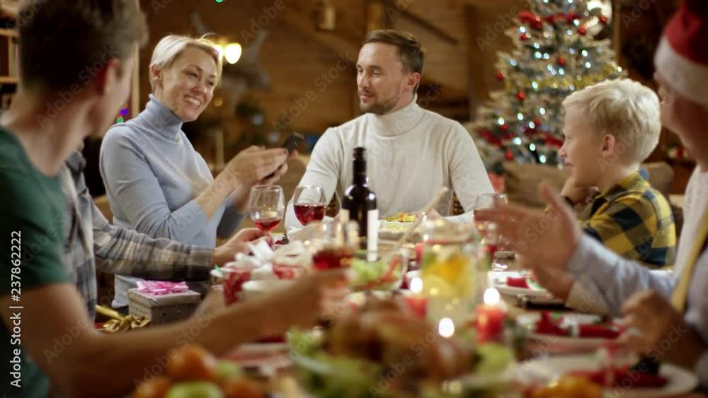 Woman takes group selfie with her family on Christmas dinner Woman takes group selfie with her family on Christmas dinner