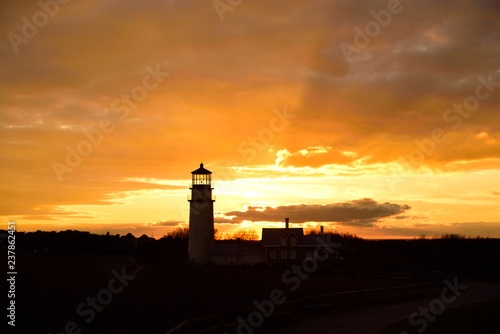 A silohuette of the Highland or Cape Cod Lighthouse at sunset in Cape Cod Massachusetts.