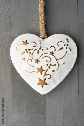 Festive heart shaped Christmas or New Year ornament with twine.