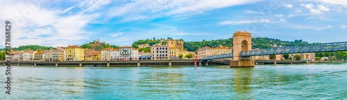 Quadro su tela Cathedral in Vienne viewed behind a pedestrian bridge over river Rhone, France