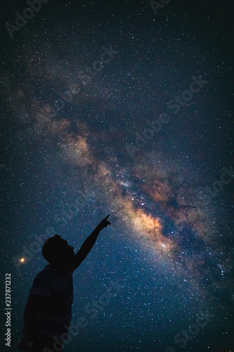 Man pointing at the starry night sky. Elements of this image are my work.