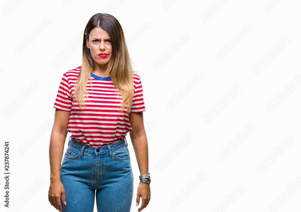 Young beautiful woman casual look over isolated background skeptic and nervous, frowning upset because of problem. Negative person. Young beautiful woman casual look over isolated background skeptic and nervous, frowning upset because of problem. Negative person.