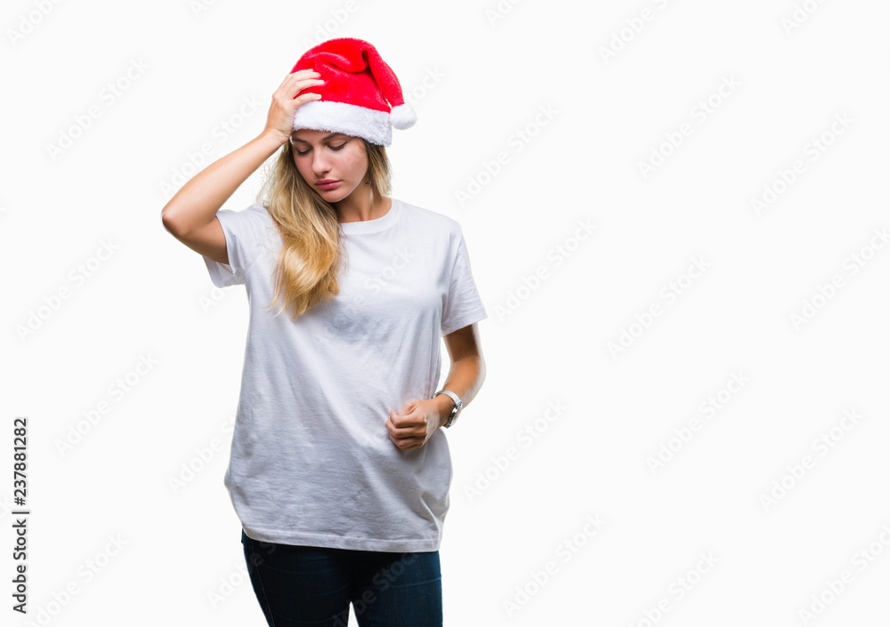 Young beautiful blonde woman wearing christmas hat over isolated background suffering from headache desperate and stressed because pain and migraine. Hands on head. Young beautiful blonde woman wearing christmas hat over isolated background suffering from headache desperate and stressed because pain and migraine. Hands on head.