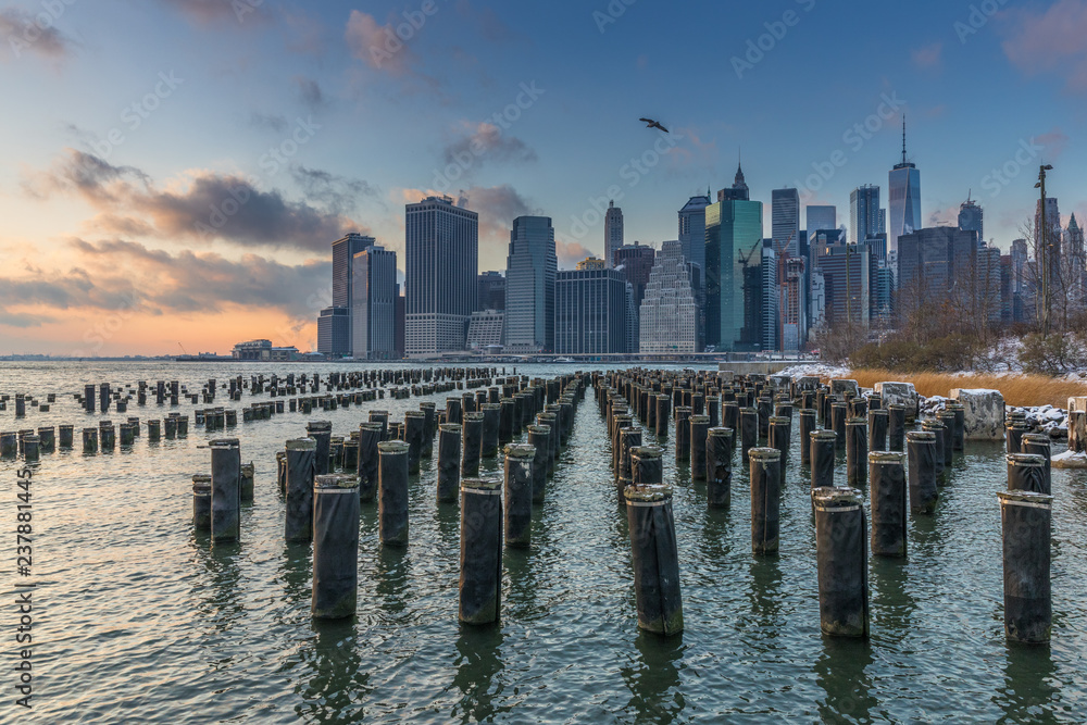 View of Manhattan at sunset from the side of the pier.