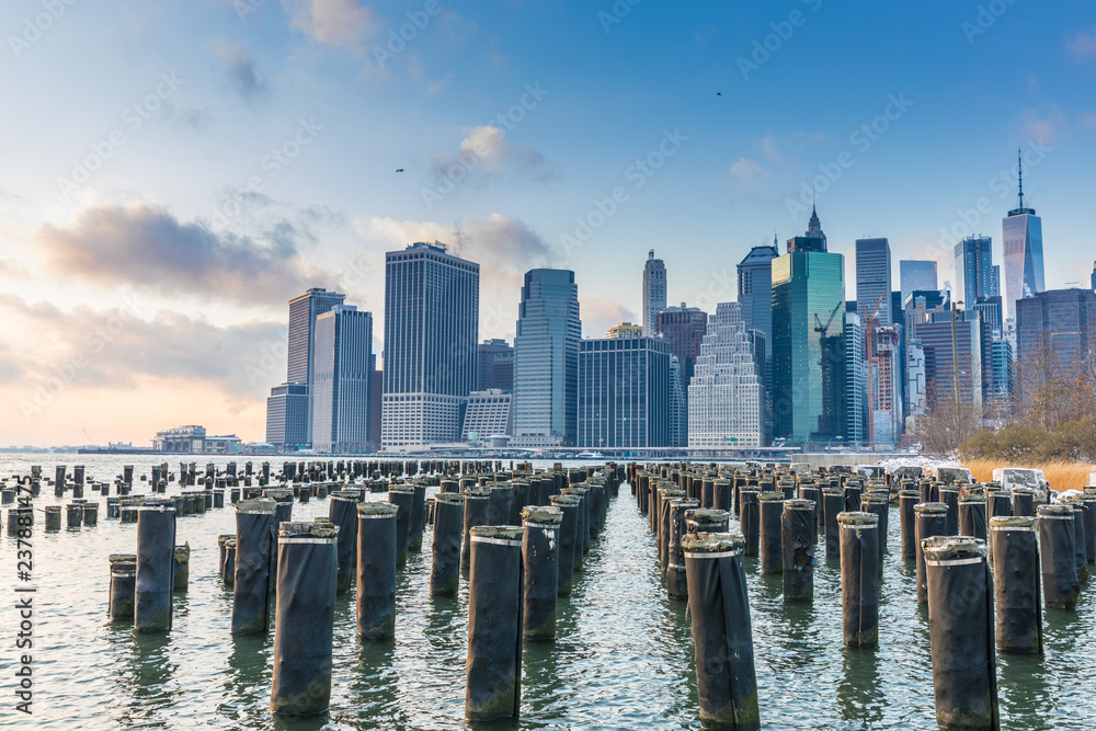 View of Manhattan at sunset from the side of the pier.
