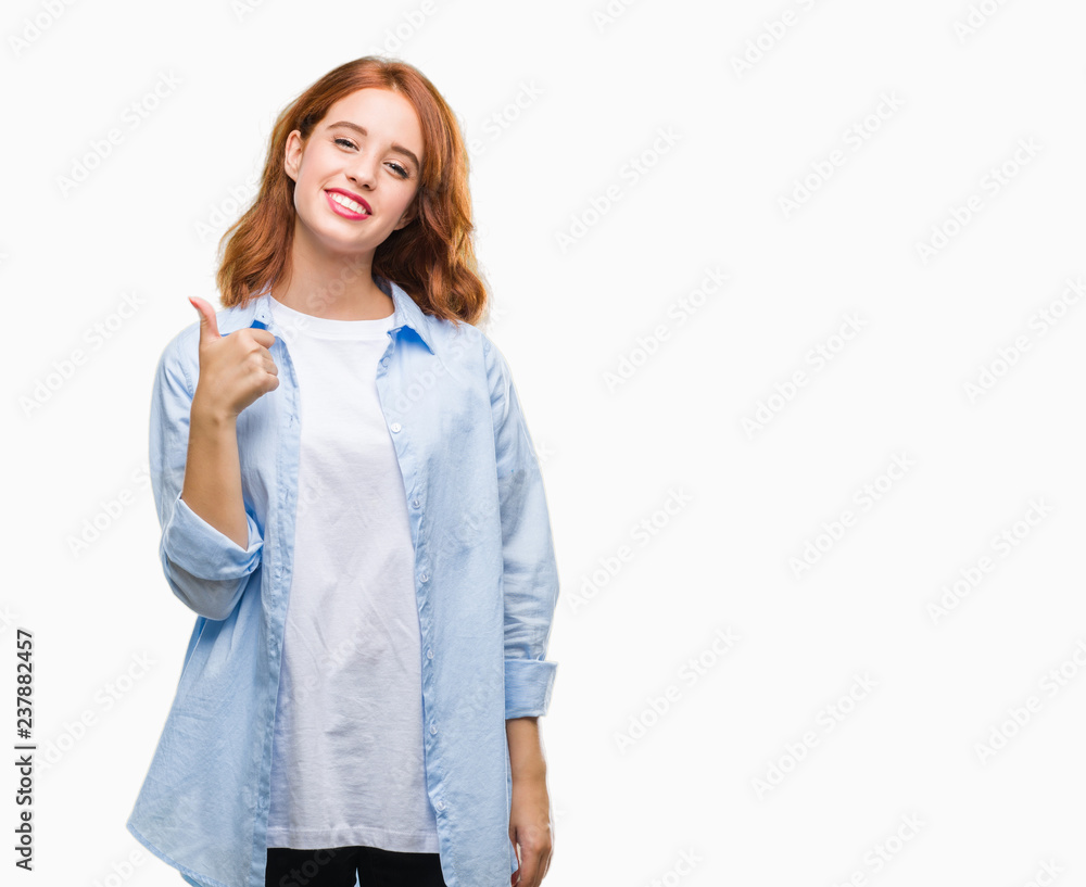 Young beautiful business woman over isolated background doing happy thumbs up gesture with hand. Approving expression looking at the camera with showing success. Young beautiful business woman over isolated background doing happy thumbs up gesture with hand. Approving expression looking at the camera with showing success.
