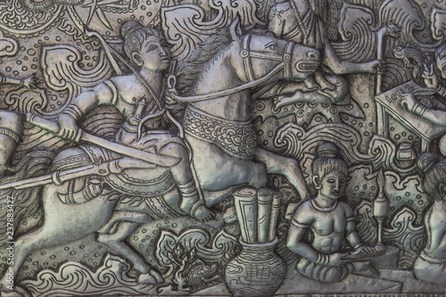 Thai style silver carving art on temple wall , Wat Srisuphan ,Chiang Mai, Thailand.