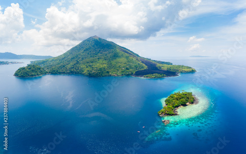 Aerial view Banda Islands Moluccas archipelago Indonesia, Pulau Gunung Api, lava flows, coral reef white sand beach. Top travel tourist destination, best diving snorkeling.