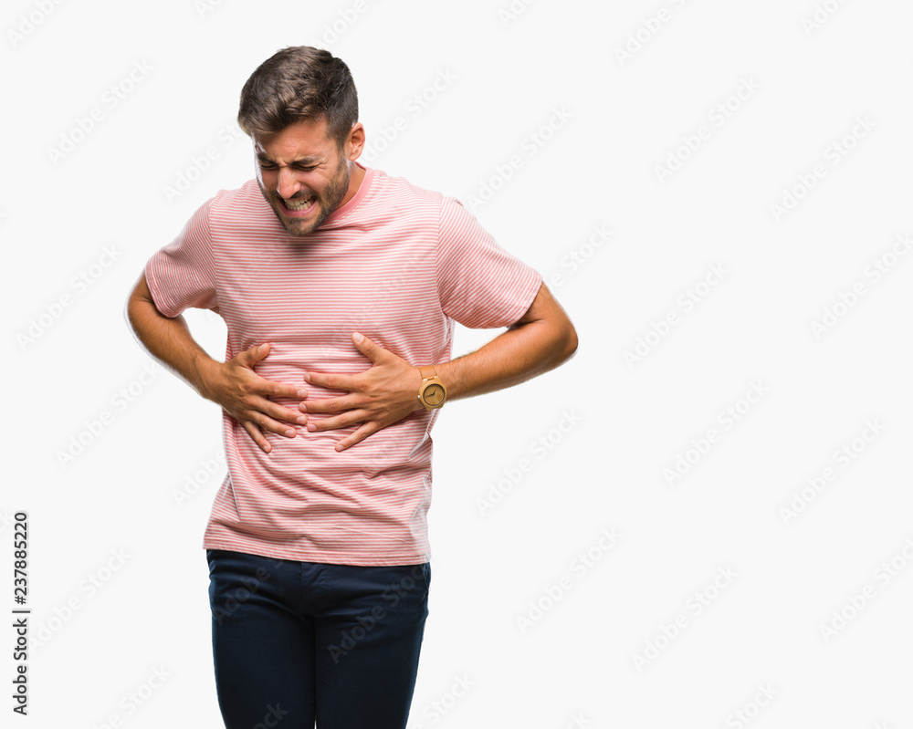 Young handsome man over isolated background with hand on stomach because indigestion, painful illness feeling unwell. Ache concept. Young handsome man over isolated background with hand on stomach because indigestion, painful illness feeling unwell. Ache concept.