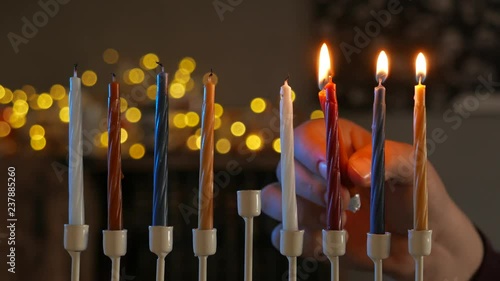 Close-up of man light hanukkah menorah photo