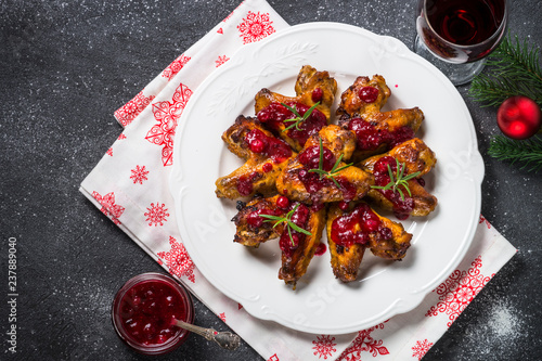 Baked chicken wings in cranberry sauce.  photo