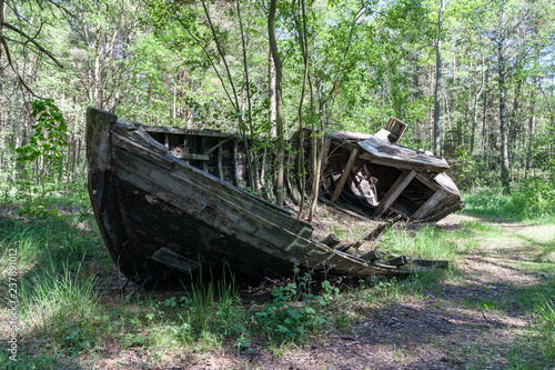 old abandoned wooden boats in the forest