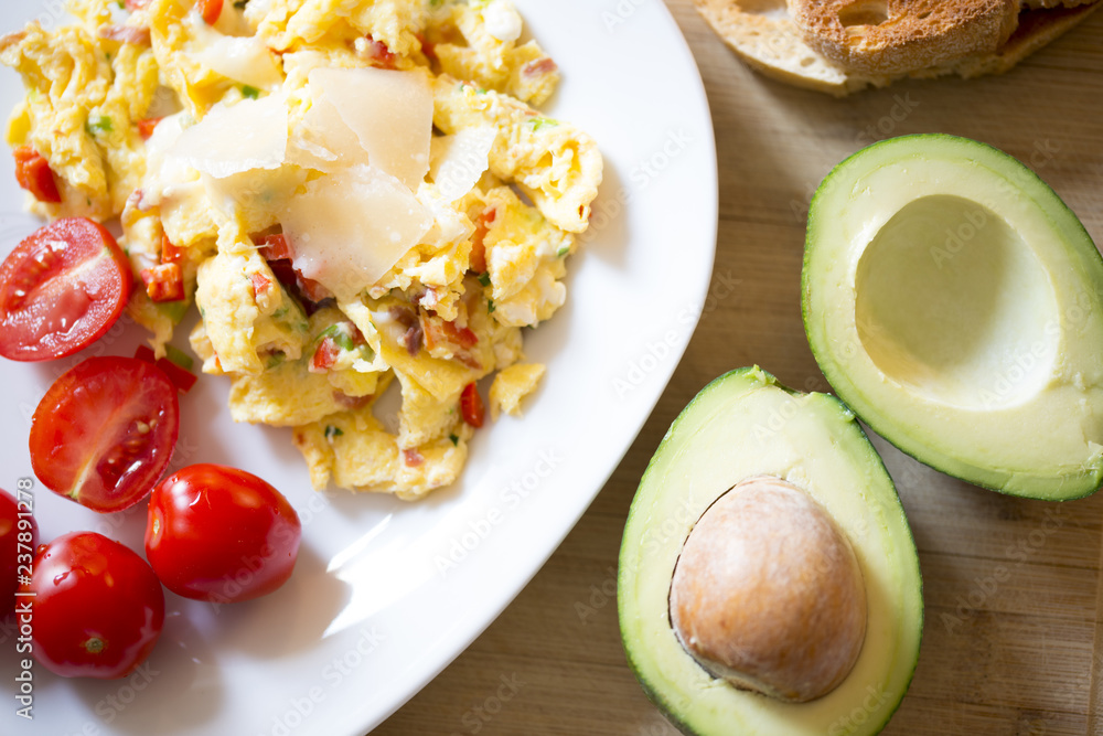Healthy breakfast with scramble eggs, vegetables and avocado Healthy breakfast with scramble eggs, vegetables and avocado