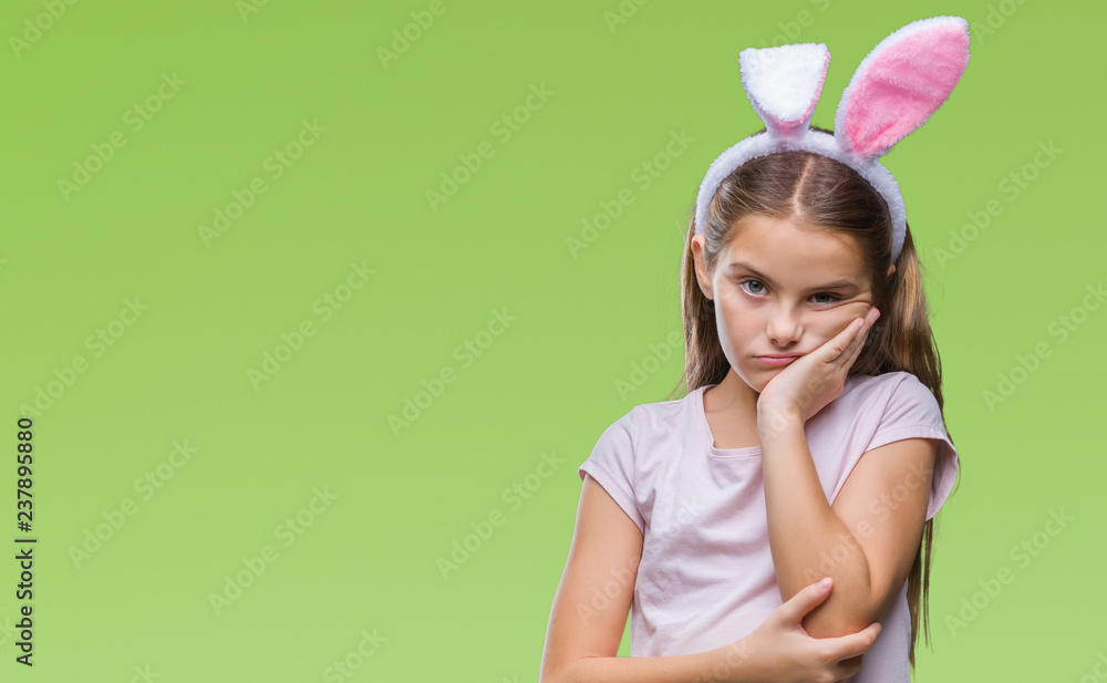 Young beautiful girl wearing easter bunny ears over isolated background thinking looking tired and bored with depression problems with crossed arms.