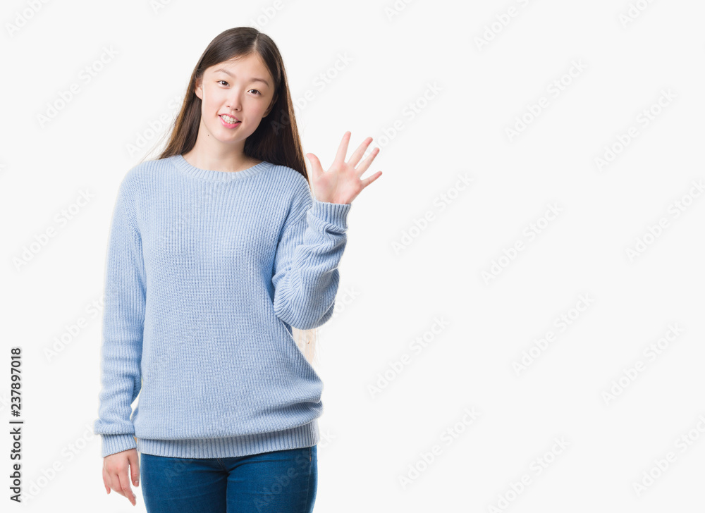 Young Chinese woman over isolated background showing and pointing up with fingers number five while smiling confident and happy. Young Chinese woman over isolated background showing and pointing up with fingers number five while smiling confident and happy.