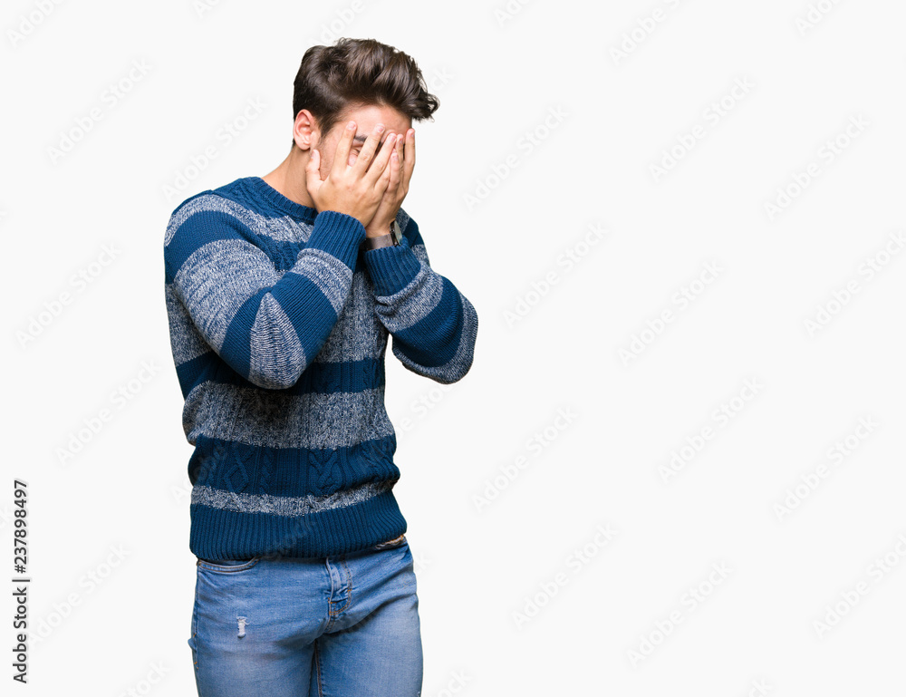 Young handsome man over isolated background with sad expression covering face with hands while crying. Depression concept. Young handsome man over isolated background with sad expression covering face with hands while crying. Depression concept.