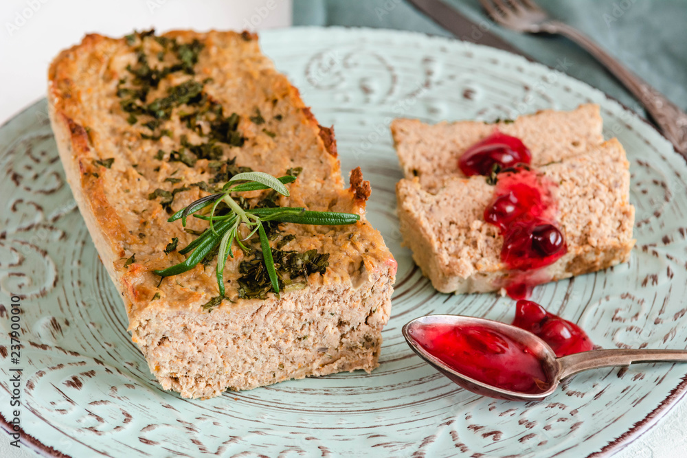 Chicken and liver pate with cranberry sauce, served on plate. Chicken and liver pate with cranberry sauce, served on plate.