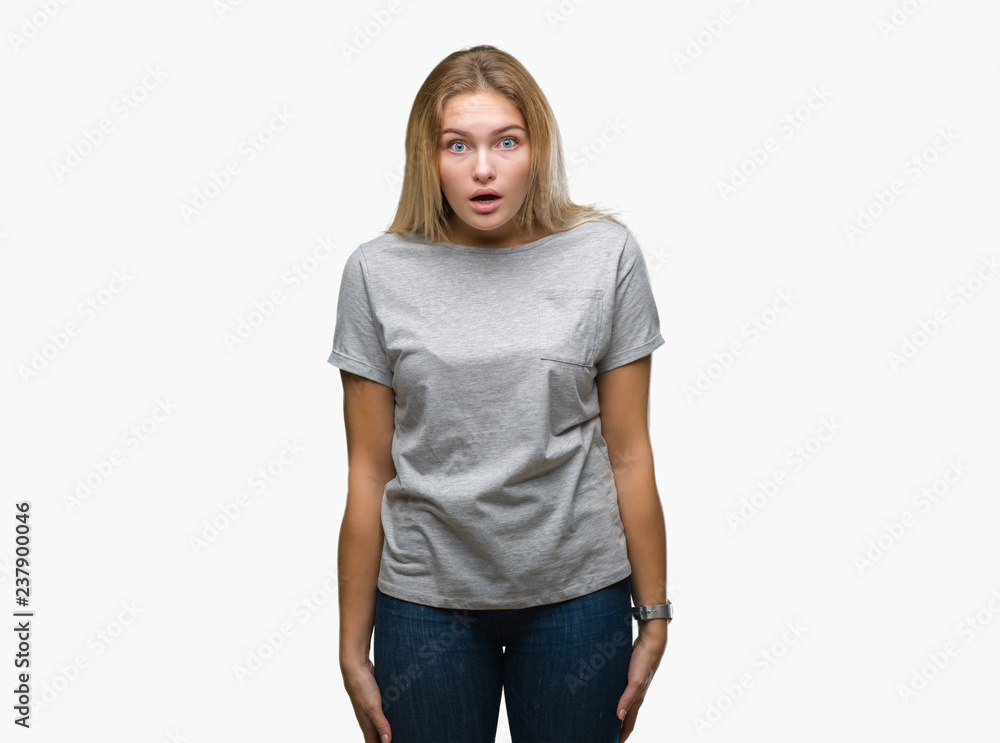 Young caucasian woman over isolated background afraid and shocked with surprise expression, fear and excited face. Young caucasian woman over isolated background afraid and shocked with surprise expression, fear and excited face.