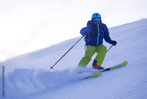 Skier having fun while running downhill