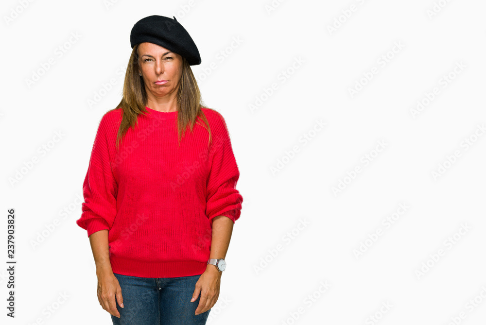 Middle age adult woman wearing fashion beret over isolated background skeptic and nervous, frowning upset because of problem. Negative person. Middle age adult woman wearing fashion beret over isolated background skeptic and nervous, frowning upset because of problem. Negative person.
