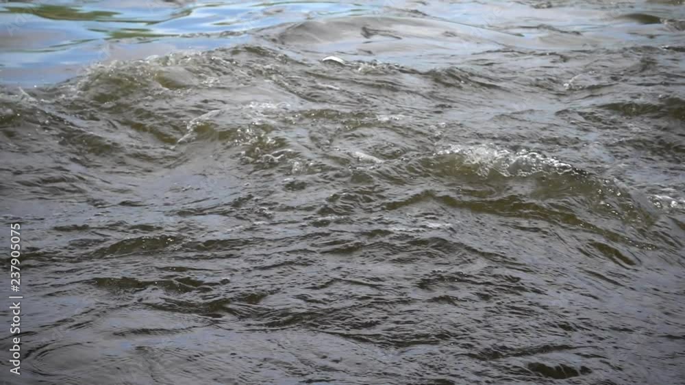 Raging water current at river rapids, close up, slow motion 240 fps. Full HD stock video footage Raging water current at river rapids, close up, slow motion 240 fps. Full HD stock video footage