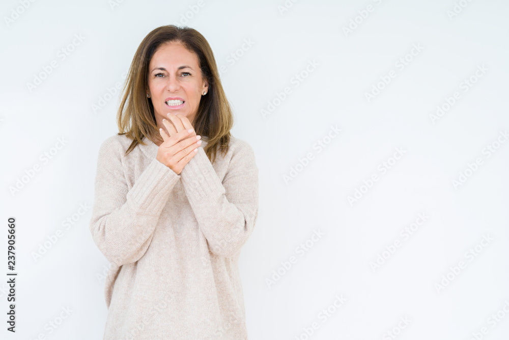 Beautiful middle age woman over isolated background Suffering pain on hands and fingers, arthritis inflammation Beautiful middle age woman over isolated background Suffering pain on hands and fingers, arthritis inflammation