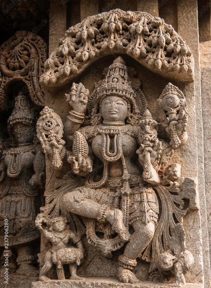 Artistic stone sculptures and carvings of Hindu Gods and Goddesses at Somanathapura Temple in Karnataka, India. 