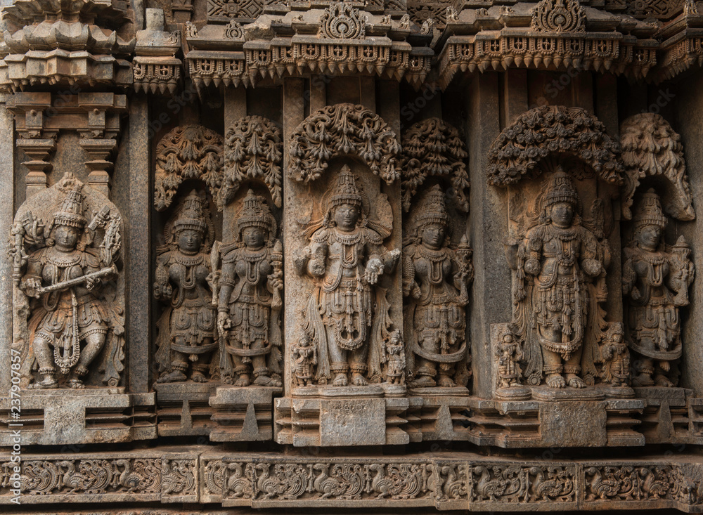 Artistic stone sculptures and carvings of Hindu Gods & Goddesses at Somanathapura Temple in Karnataka, India. 