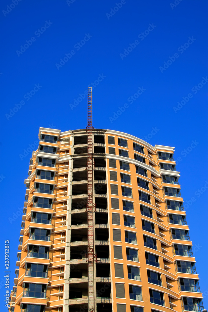 Fototapeta premium Unfinished buildings in the blue sky