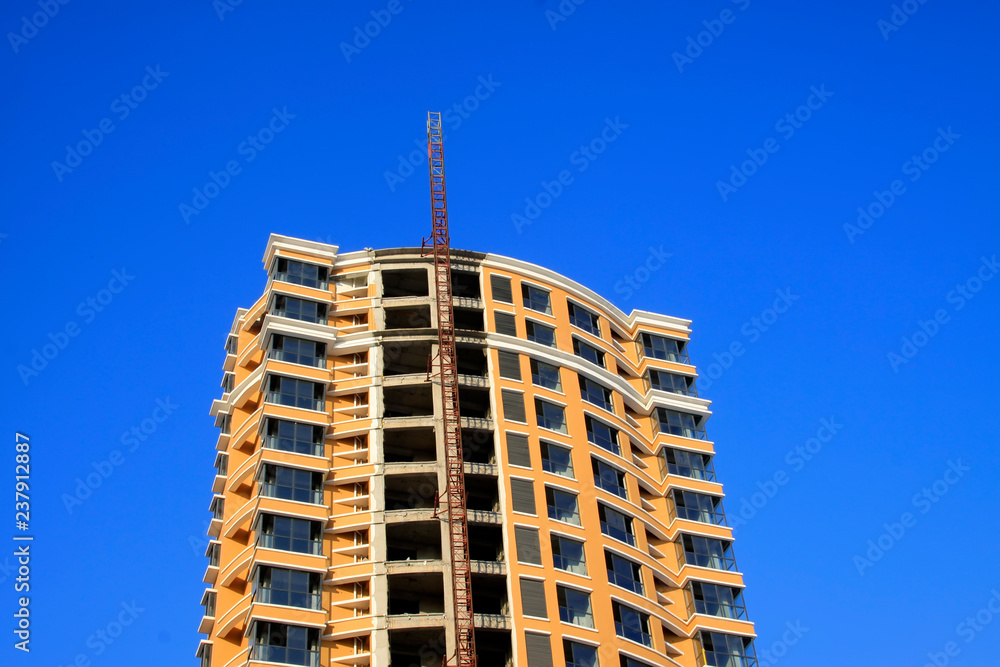 Fototapeta premium Unfinished buildings in the blue sky