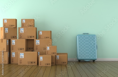 Moving boxes and valise in empty room in front of a blue wall (3D Rendering) © abdulkadir