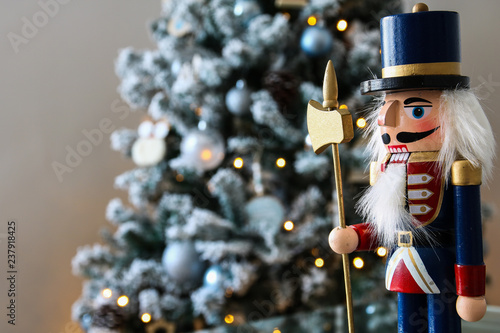 Nutcracker with Christmas scene in background