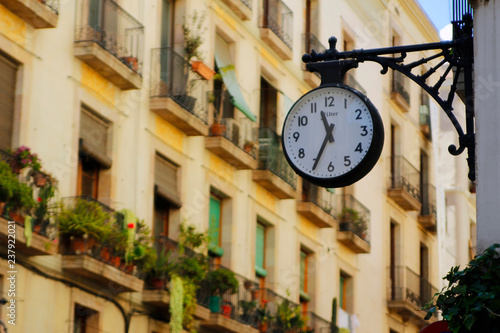 Clock attached to the building - Barcelona