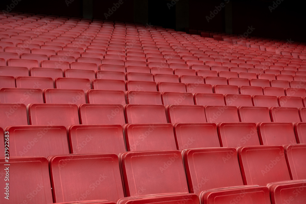 Red seat row in stadium Red seat row in stadium