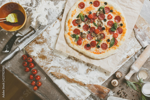 Top view cooking pizza with...