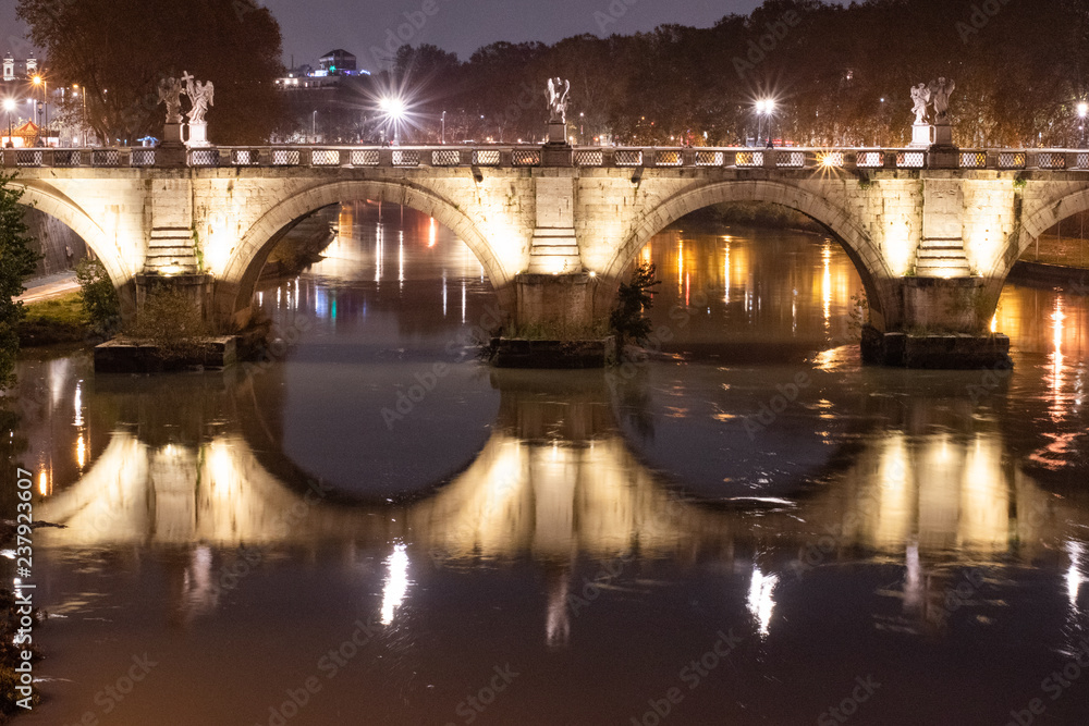 Night Image of Bridge Named Ponte Sant'Angelo  In Rome Italy Across Tiber River Near Castle Saint Angelo.