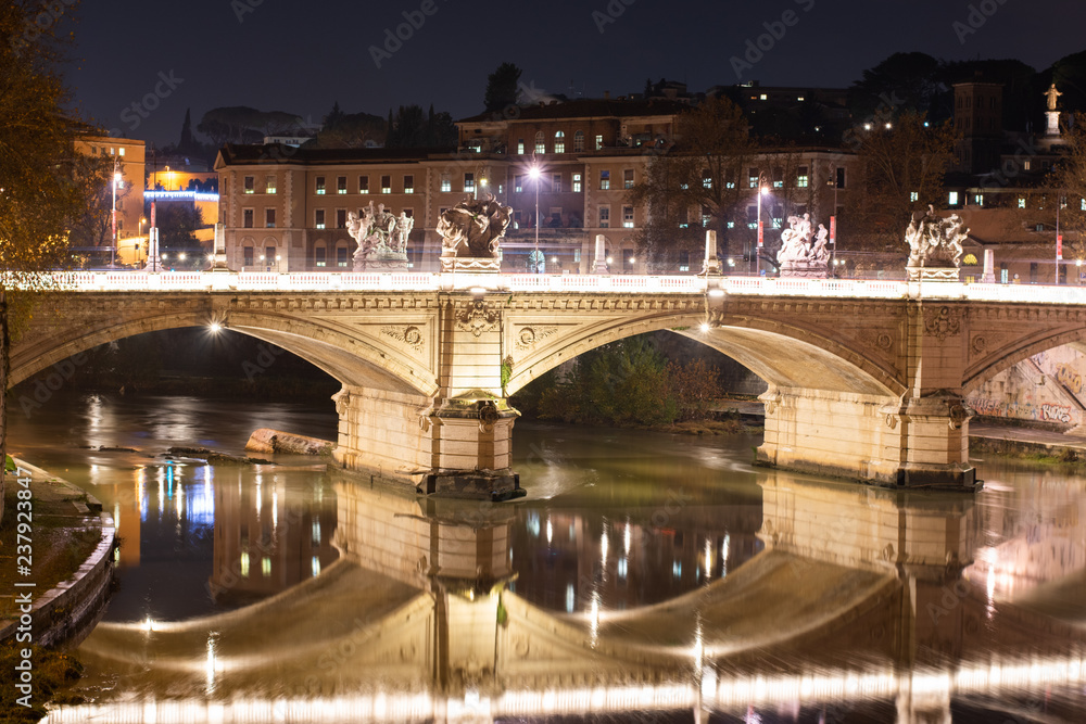 Night Image of Bridge Named Ponte Vittorio Emanuele II In Rome Italy Across Tiber River.