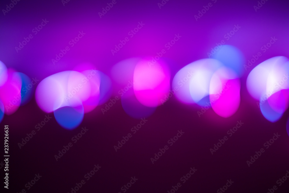 purple background with blurred multicolored bokeh purple background with blurred multicolored bokeh
