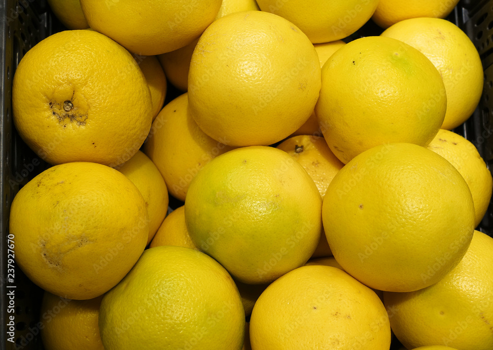 beautiful backdrop of ripe grapefruit yellow sale at vegetable market beautiful backdrop of ripe grapefruit yellow sale at vegetable market