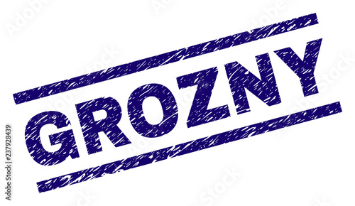 GROZNY seal print with grunge style. Blue vector rubber print of GROZNY text with dirty texture. Text label is placed between parallel lines.