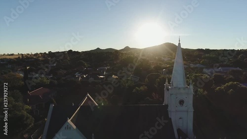 Jib Reveal of old  Church with Sunset in the background