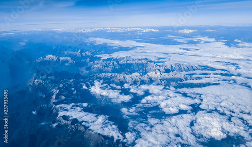 The view from the airplane illuminator on Alps.
