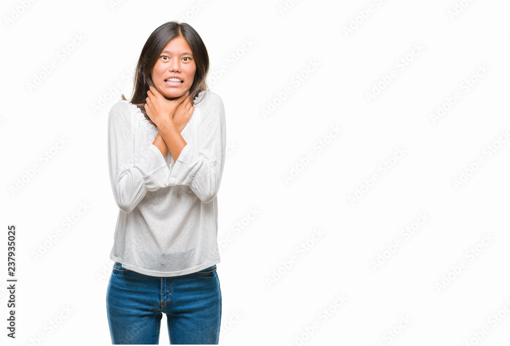 Young asian woman over isolated background shouting and suffocate because painful strangle. Health problem. Asphyxiate and suicide concept. Young asian woman over isolated background shouting and suffocate because painful strangle. Health problem. Asphyxiate and suicide concept.