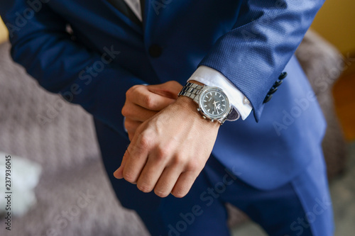 A businessman in a suit. A businessman is preparing to meet with clients.