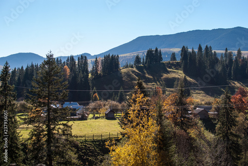 Colorful autumn landscape in the mountain village. Sunny day in the Carpathian mountains. Ukraine  Europe.